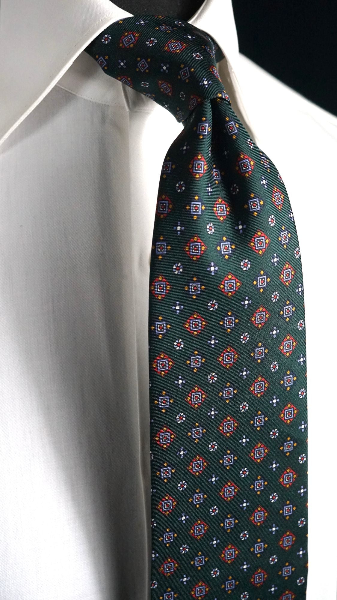 Benedetta green foulard silk tie knotted on a white shirt