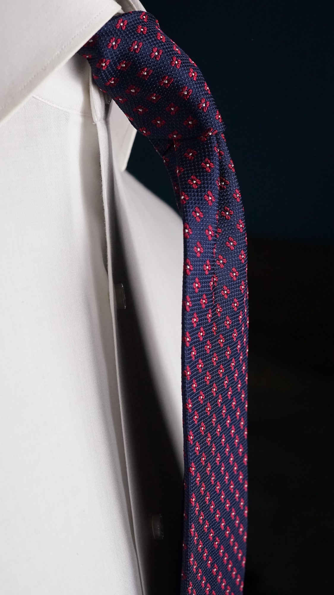 Side view of the Fiammetta navy floral silk tie