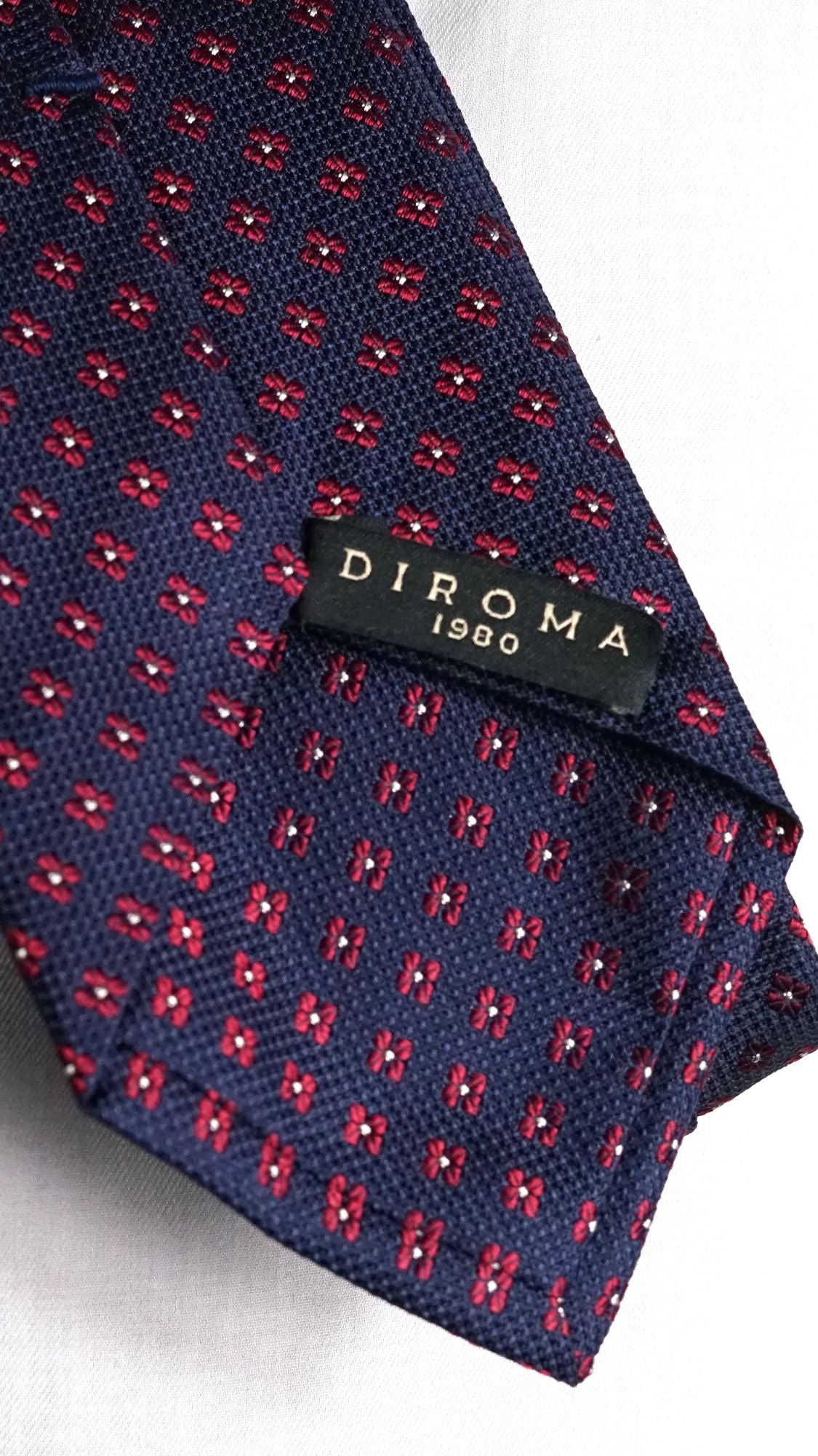 DIROMA 1980 label on the Fiammetta navy floral silk tie