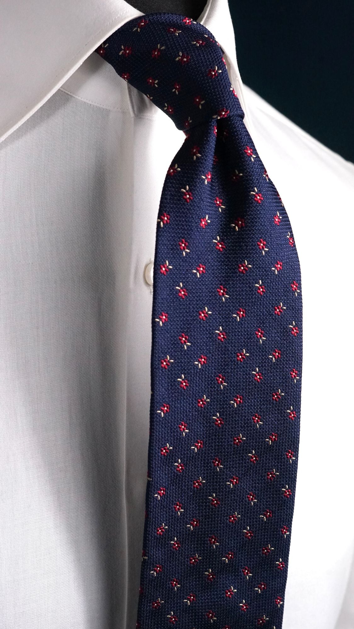 Close-up of the Ippolita navy floral jacquard silk tie knot