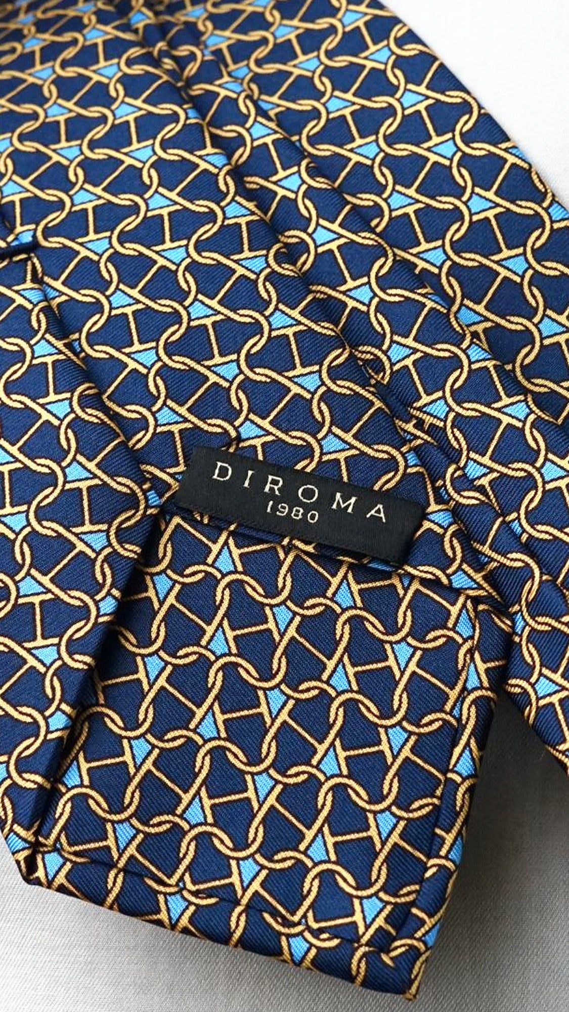 DIROMA 1980 label on the Marcella navy chain-link silk tie
