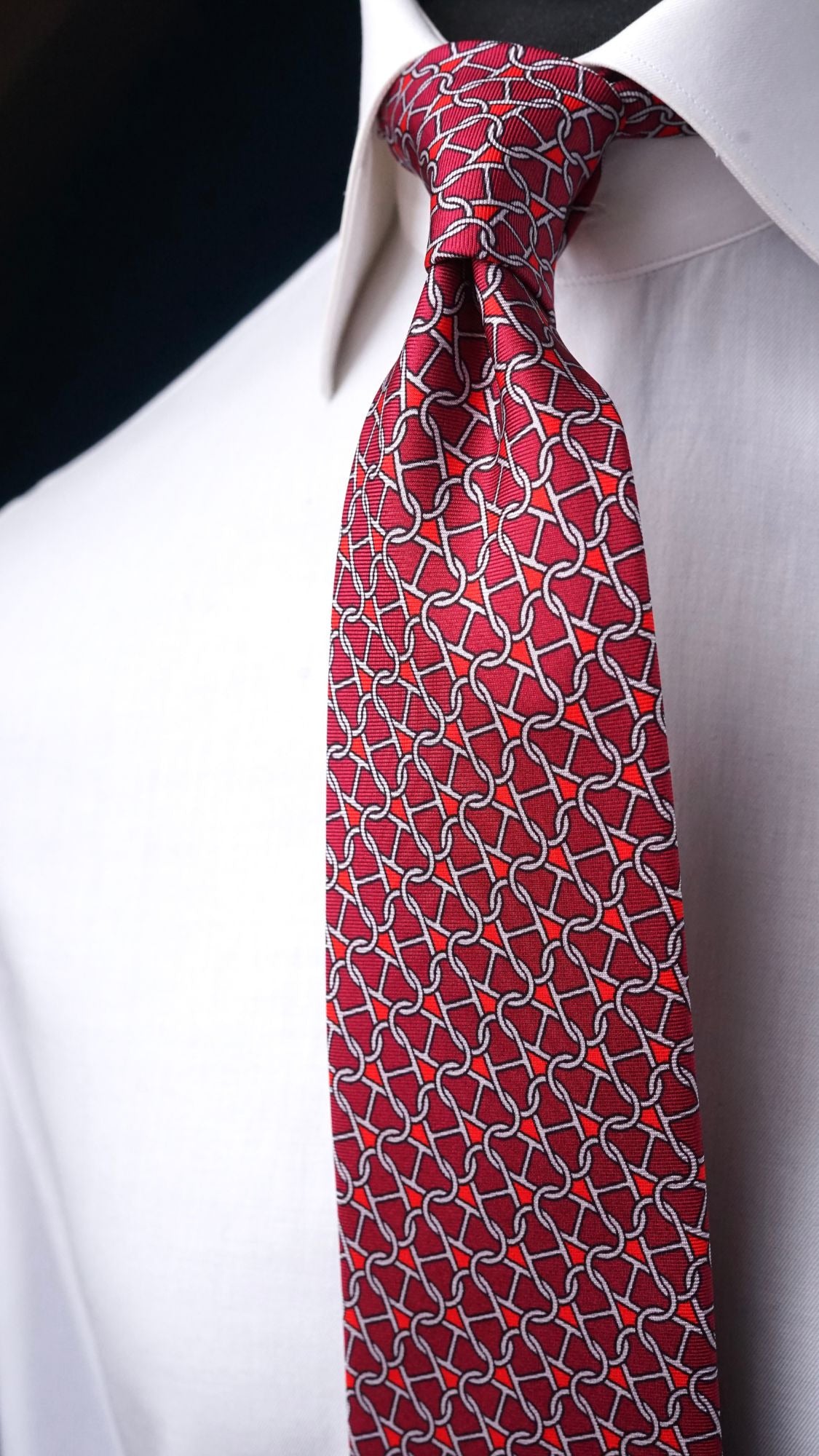 Rosalba red chain-link silk tie, angled view