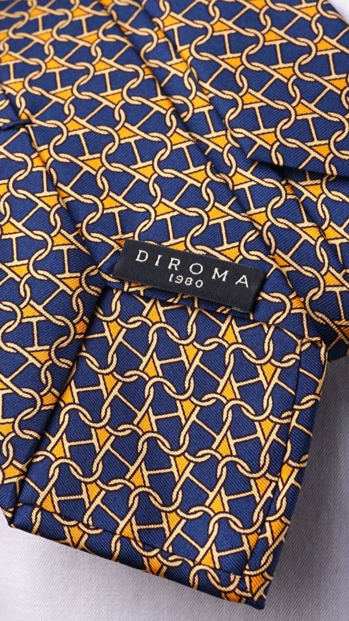 DIROMA 1980 label on the Cosima navy chain-link silk tie