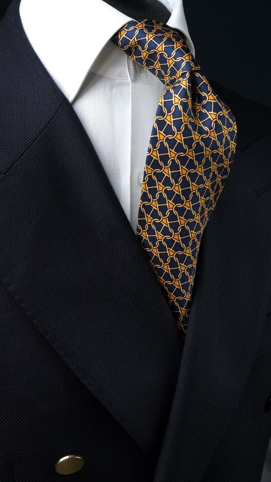Cosima navy chain-link silk tie, angled view with blazer
