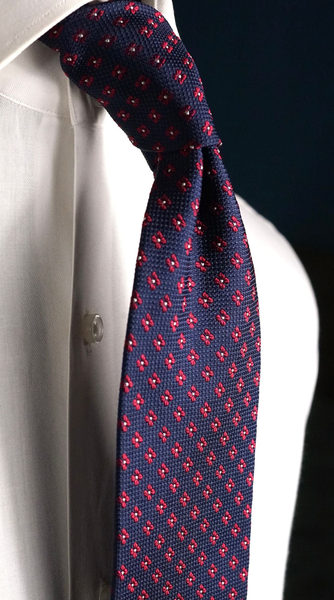 Fiammetta navy floral silk tie knotted on a white shirt