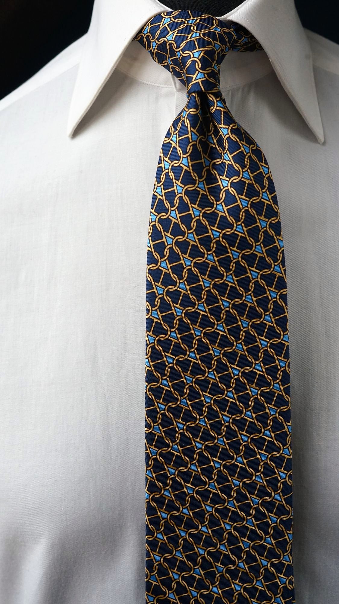 Close-up of the Marcella navy chain-link silk tie knot