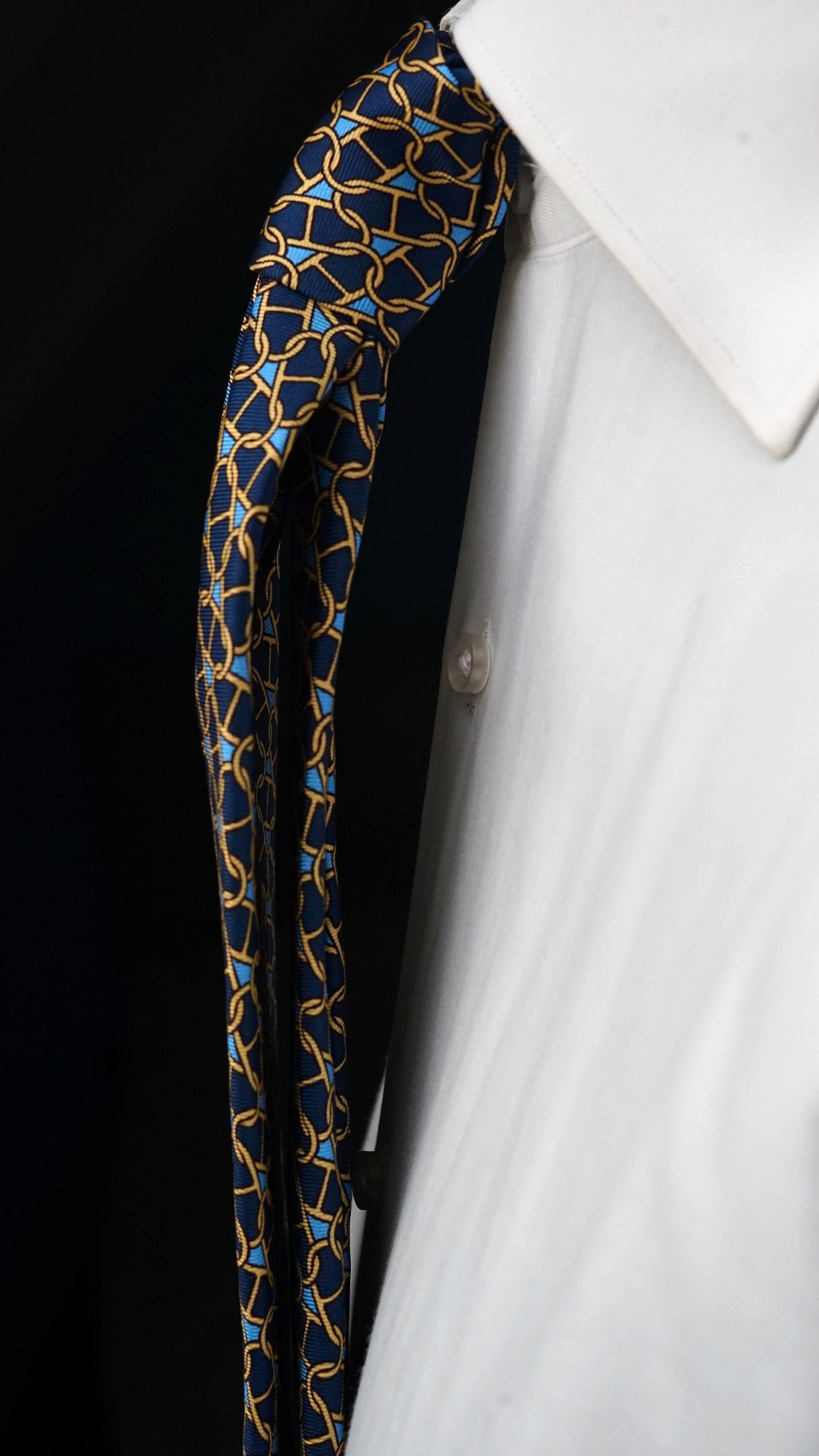 Side view of the Marcella navy chain-link silk tie